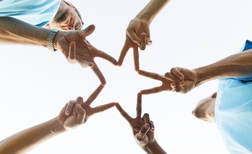 Group of happy and diverse volunteers